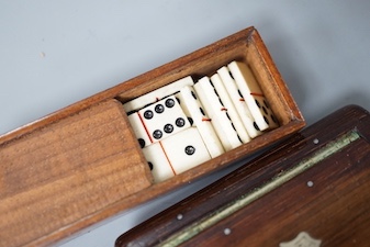 Two carved wood snuff boxes and a cased bone domino set